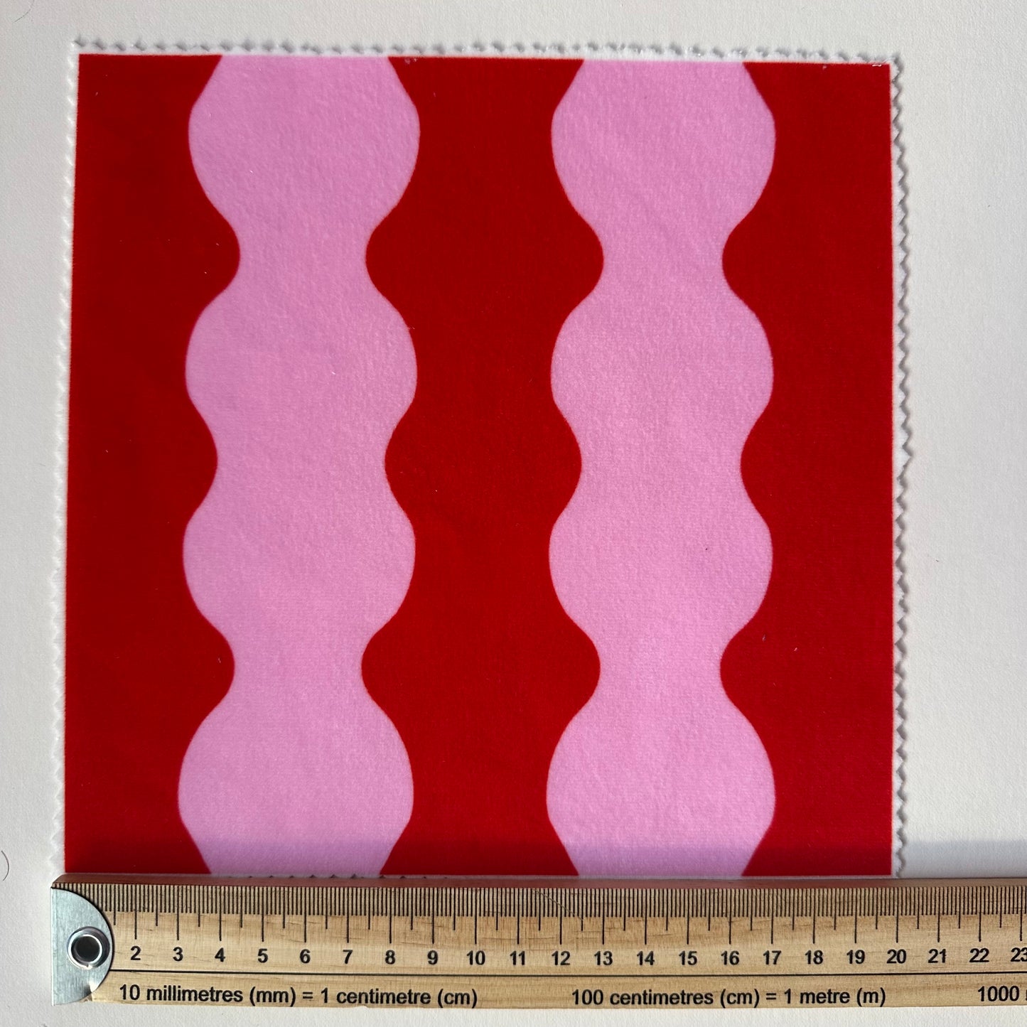 ‘Wiggle With Me’ wavy fabric in red and pink colours