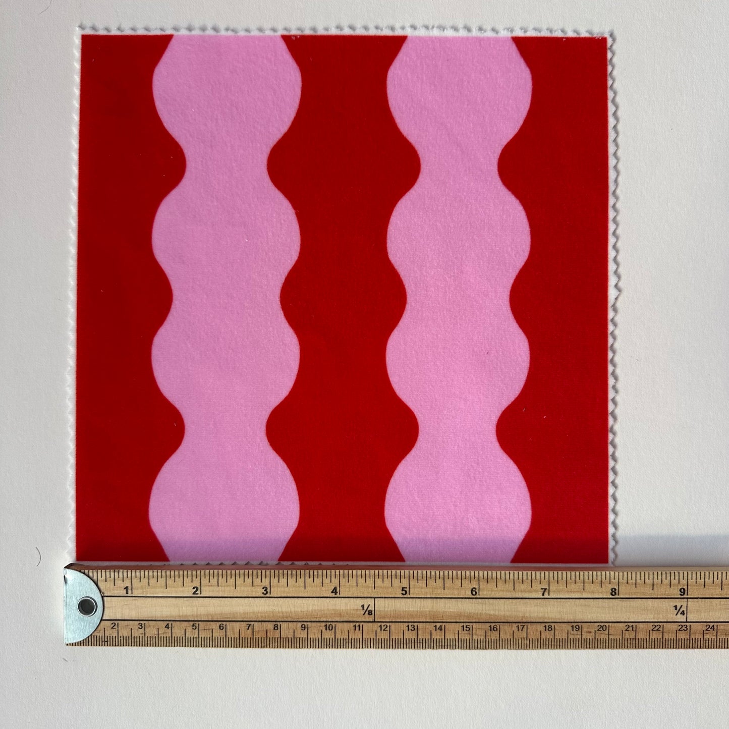 ‘Wiggle With Me’ wavy fabric in red and pink colours