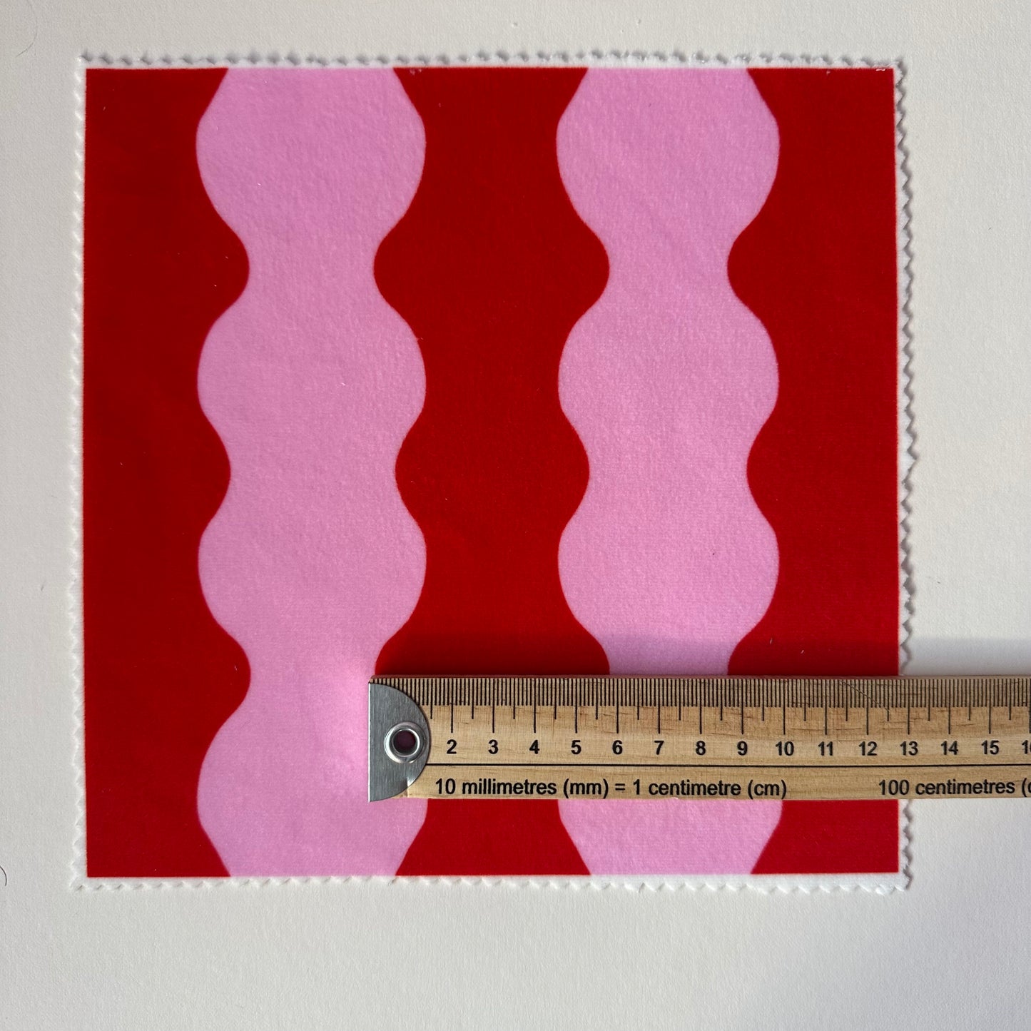 ‘Wiggle With Me’ wavy fabric in red and pink colours