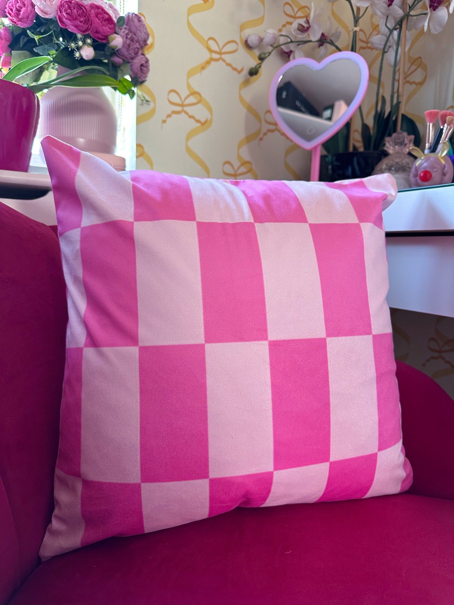 Pink velvet cushion with checkerboard design modern luxury interior