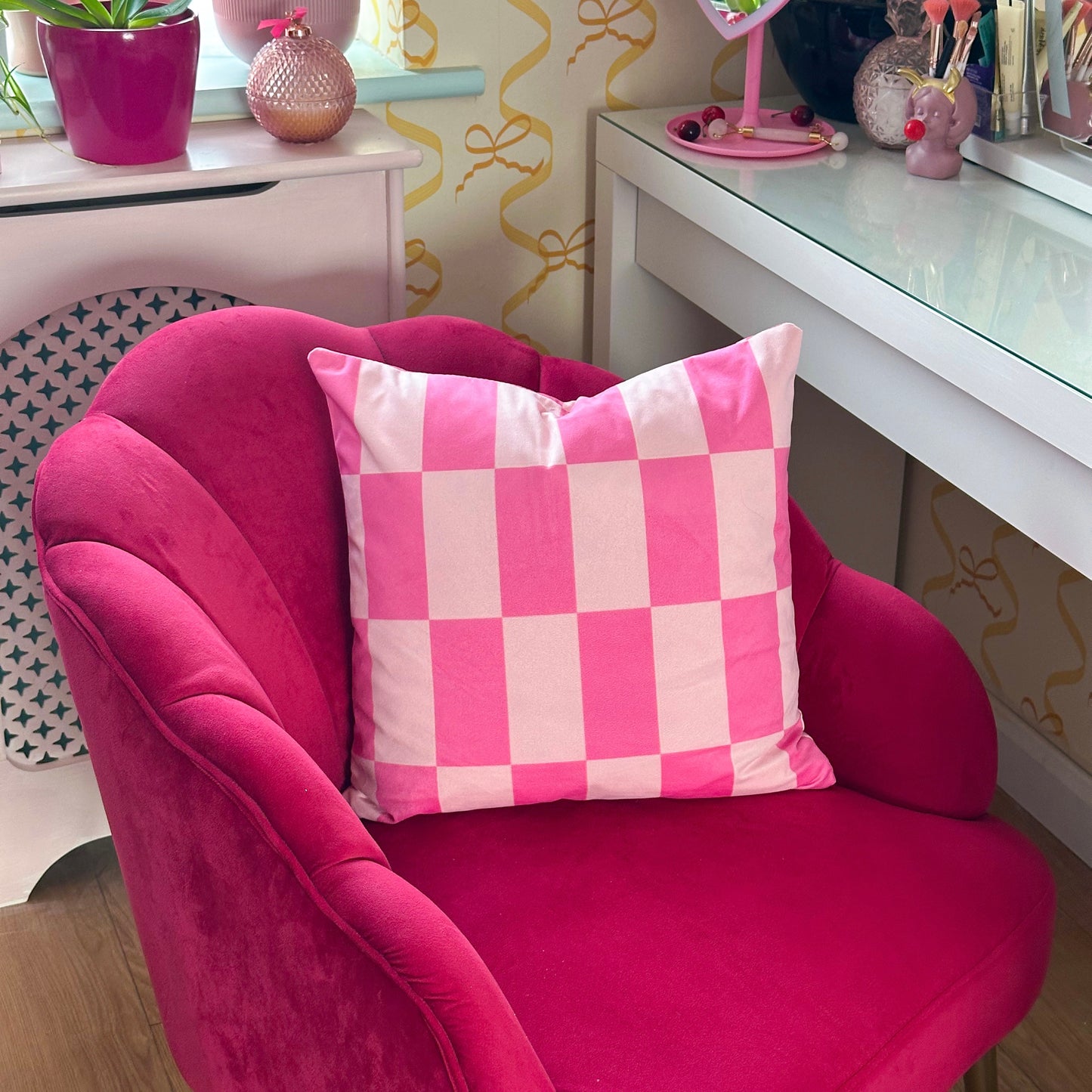 pink velvet cushion with checkerboard design dopamine home decor maximalist home accessories