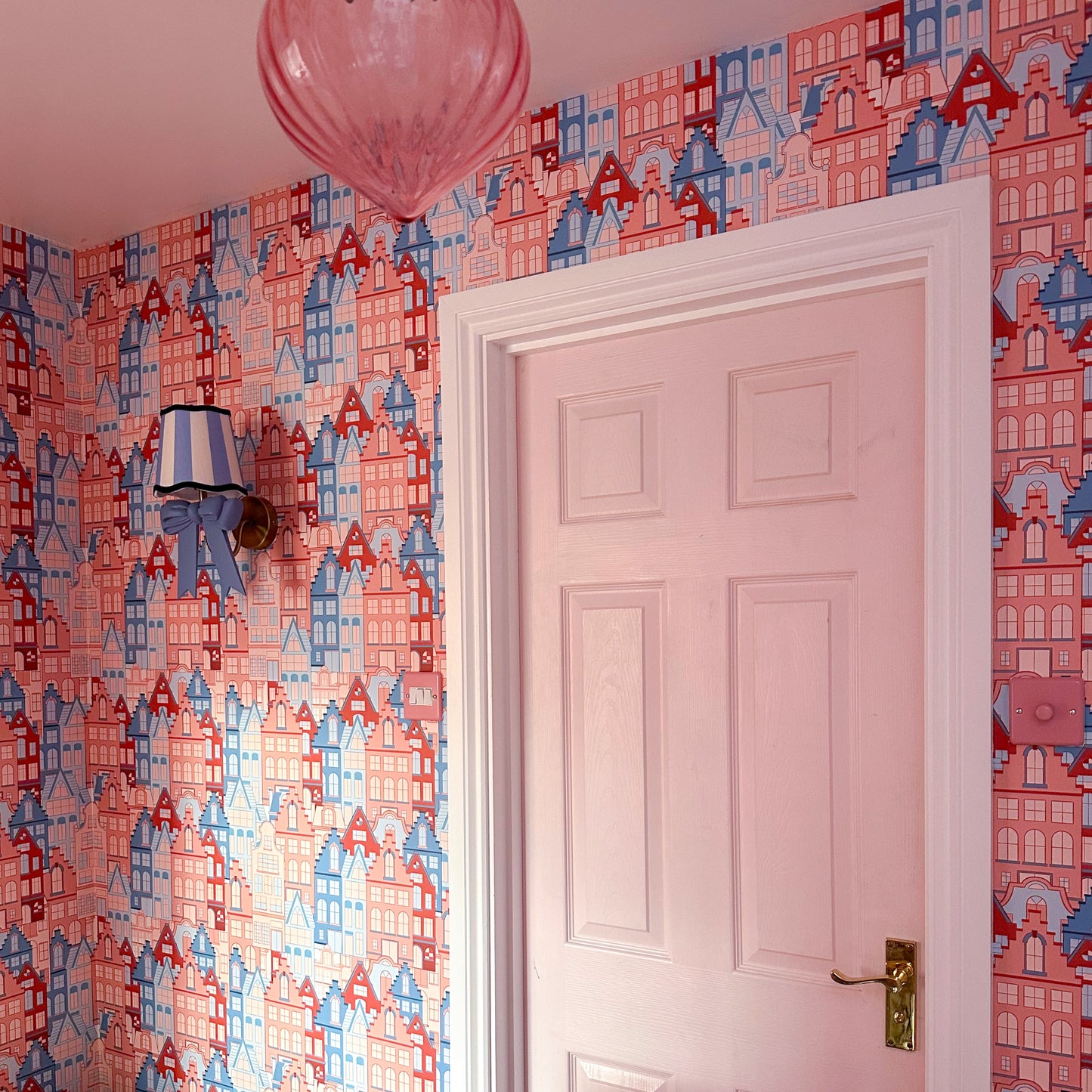 ‘House Party' vintage inspired wallpaper in terracotta and blue