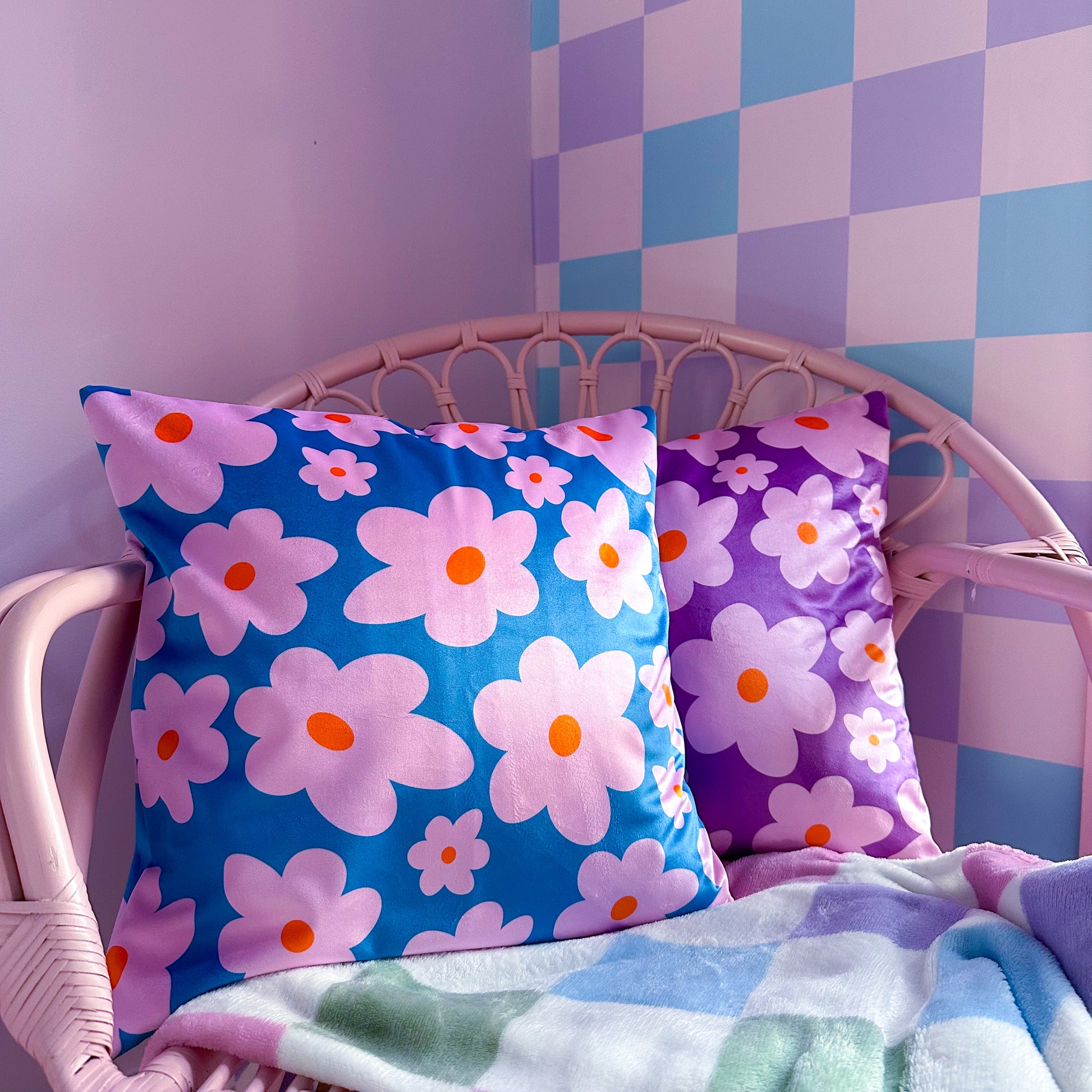 velvet cushions daisy motif in pink, purple and blue colours
