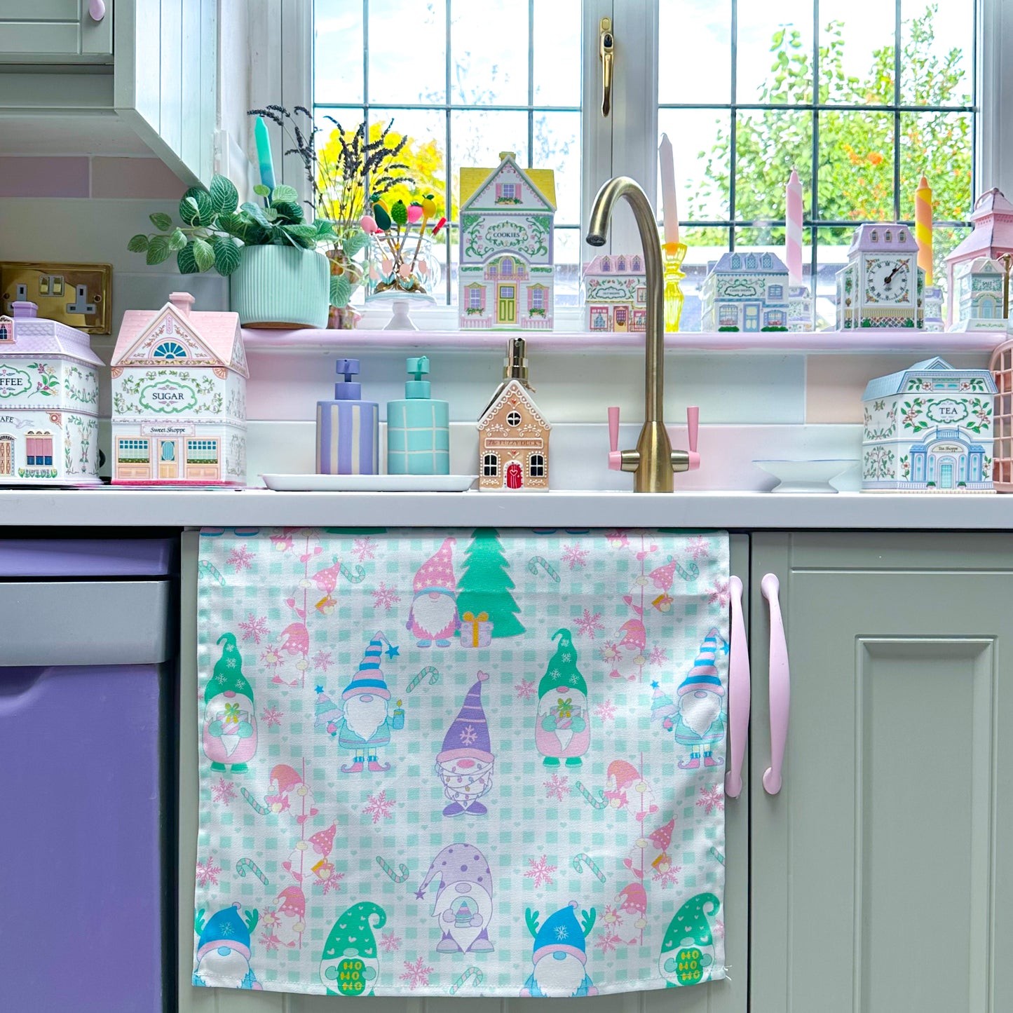 Christmas tea towel for kitchen with pastel gonks
