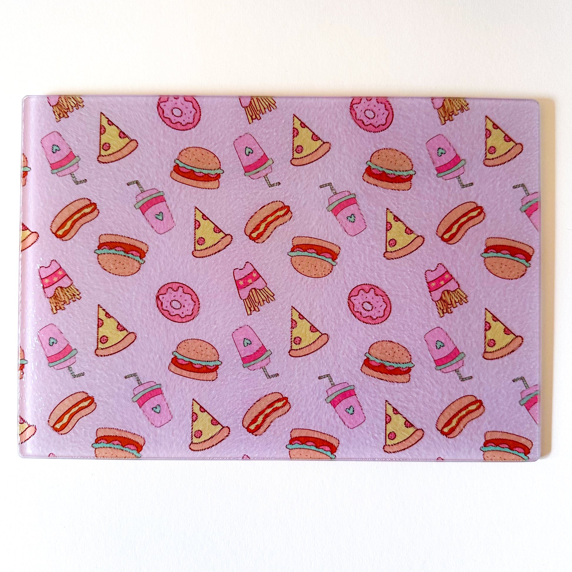 retro fast food theme chopping board, glass worktop saver in pink colour 