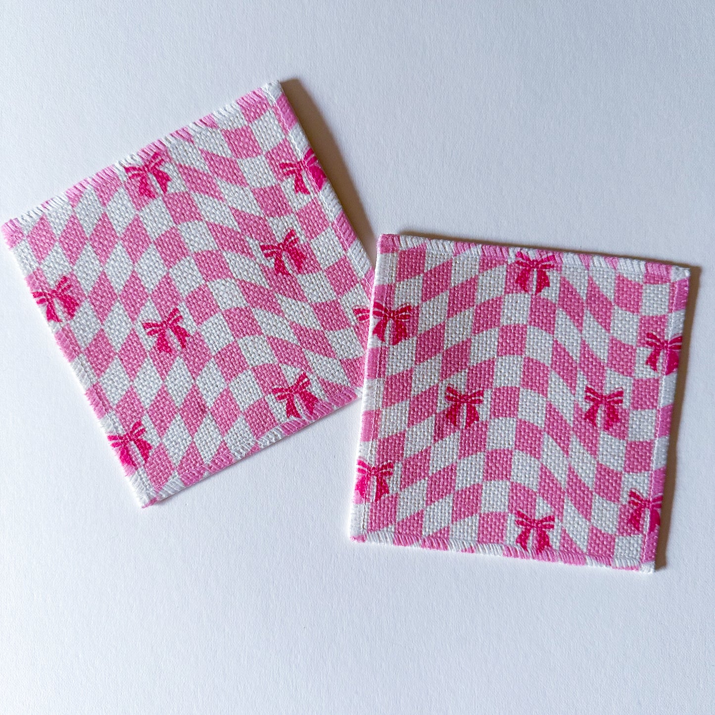 pink checkerboard coaster for drinks