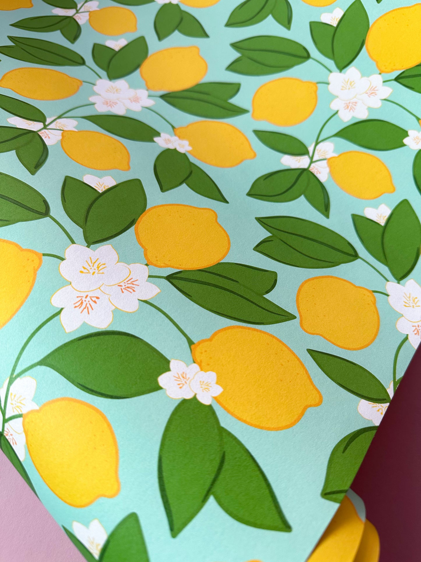 wallpaper with lemons, leaves, and flowers motif on a light blue background, quirky decor, dopamine wall coverings