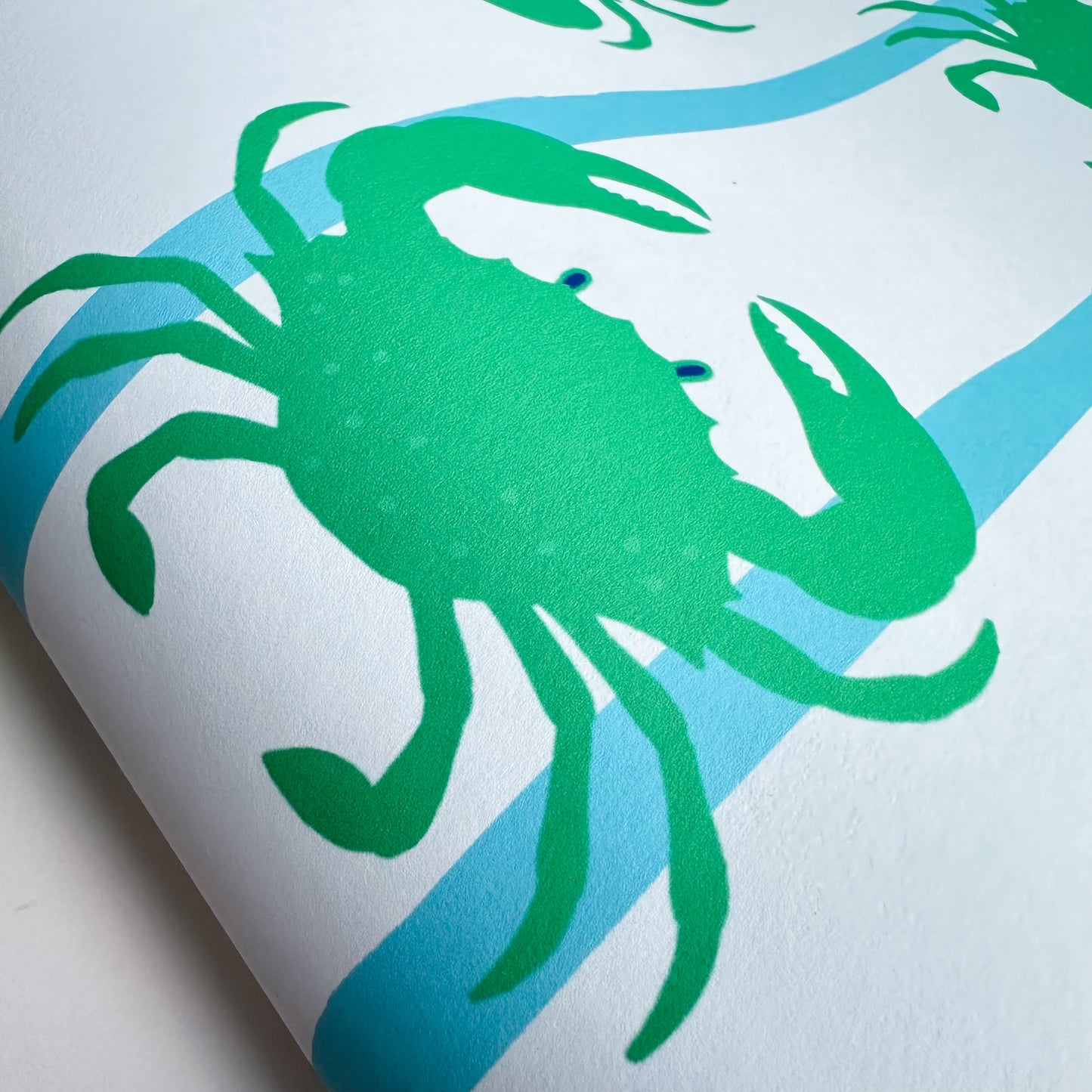 bathroom wallpaper with crabs in blue and green colours 