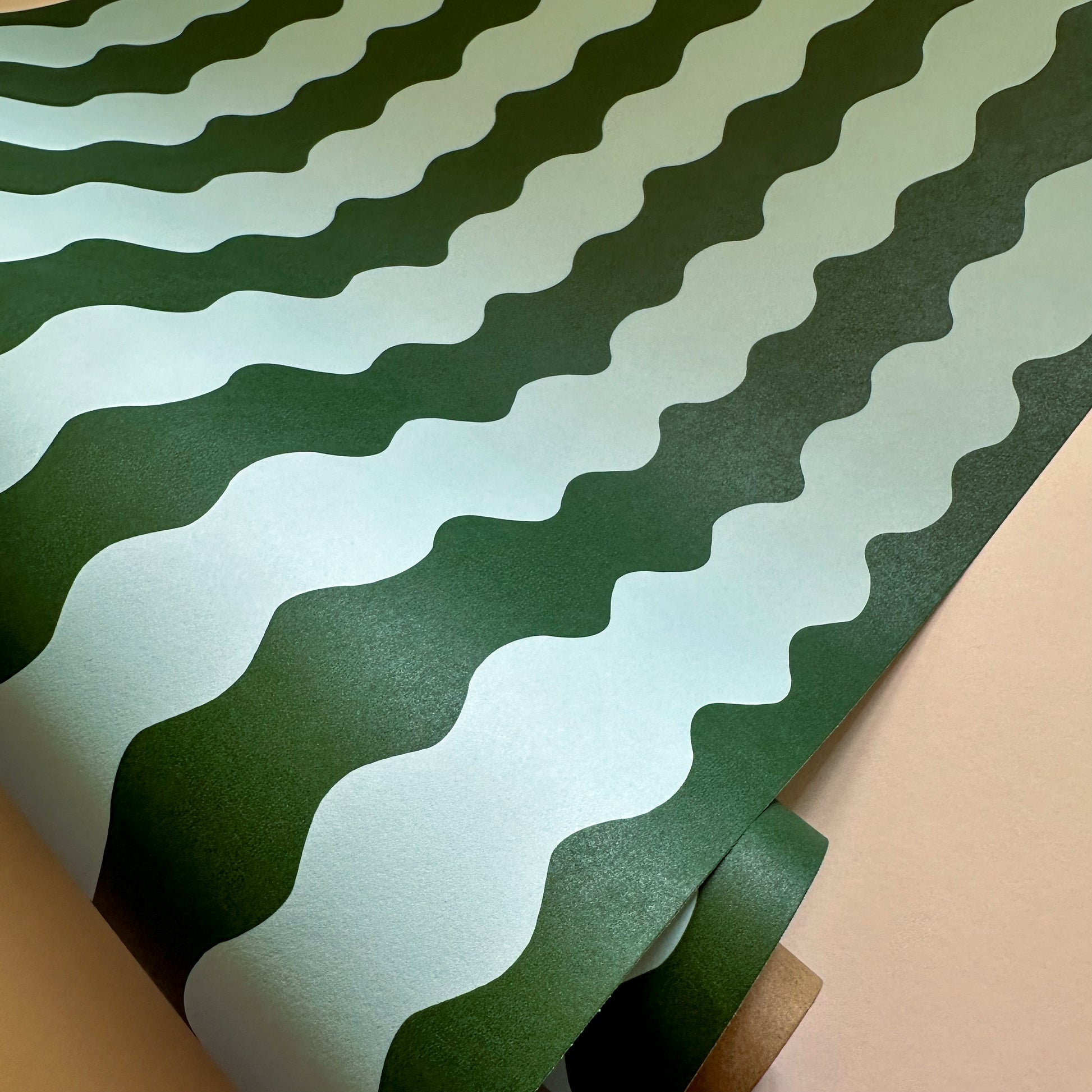 wavy wallpaper in forest green and light blue colours for bedroom