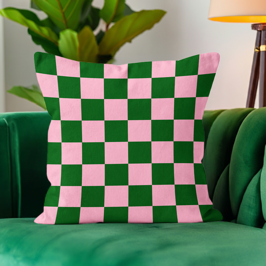 ‘Checkmate’ checkerboard velvet cushion in pink and green colours