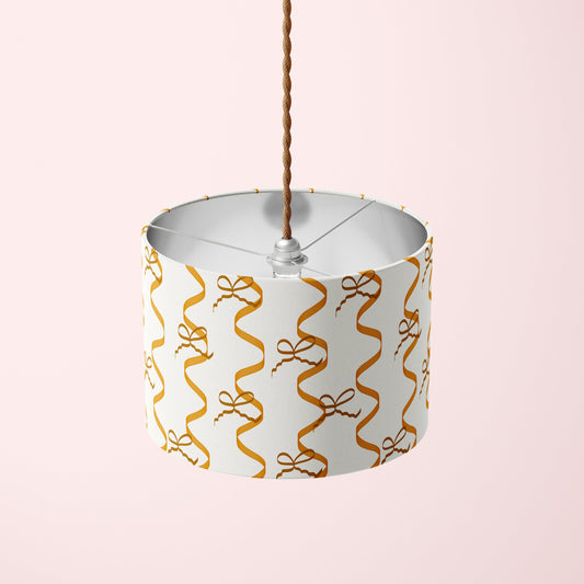 lampshade with bows and ribbons pattern in golden caramel brown colour