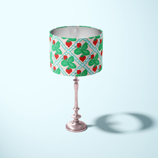 decorative lampshade featuring strawberry pattern on a light blue and pink background