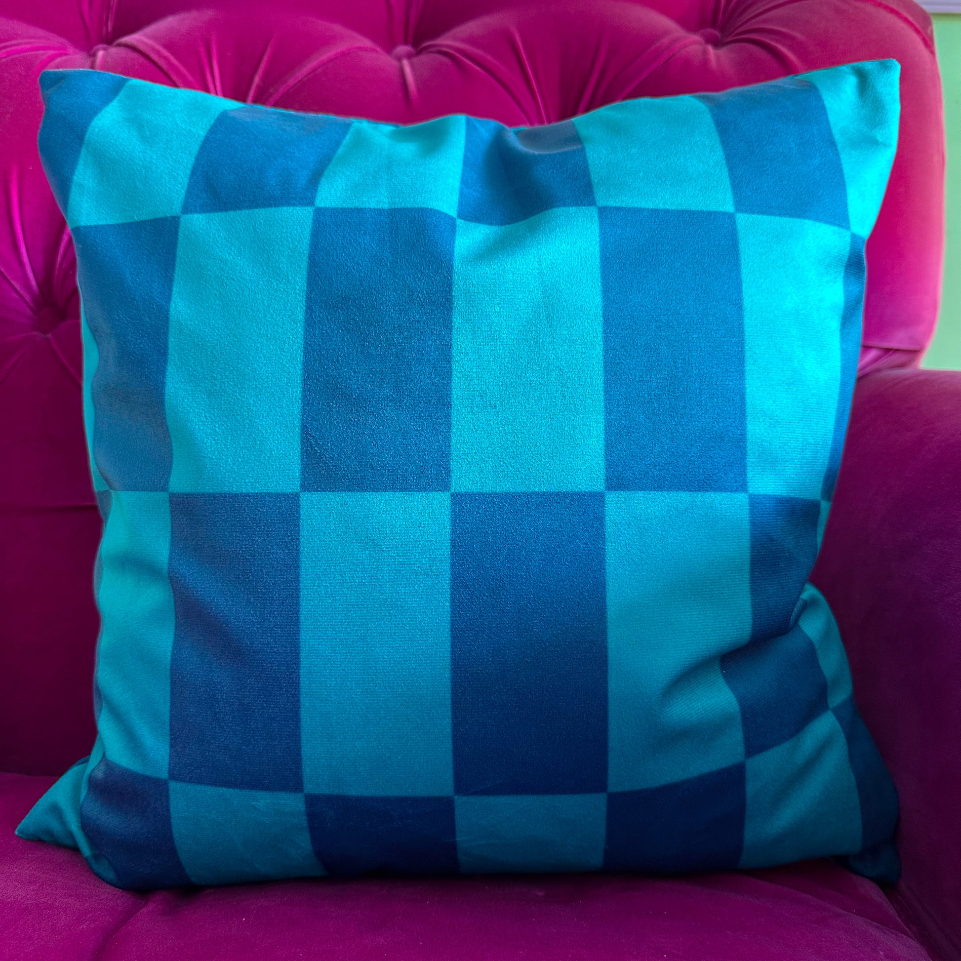 velvet cushion in turquoise blue with checkered pattern