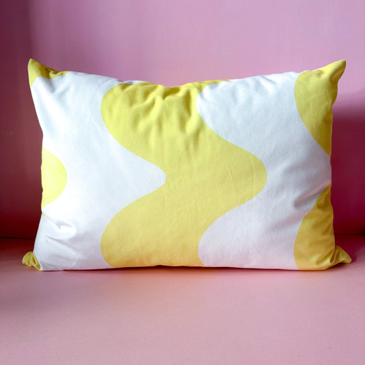 yellow velvet cushion with wavy abstract design