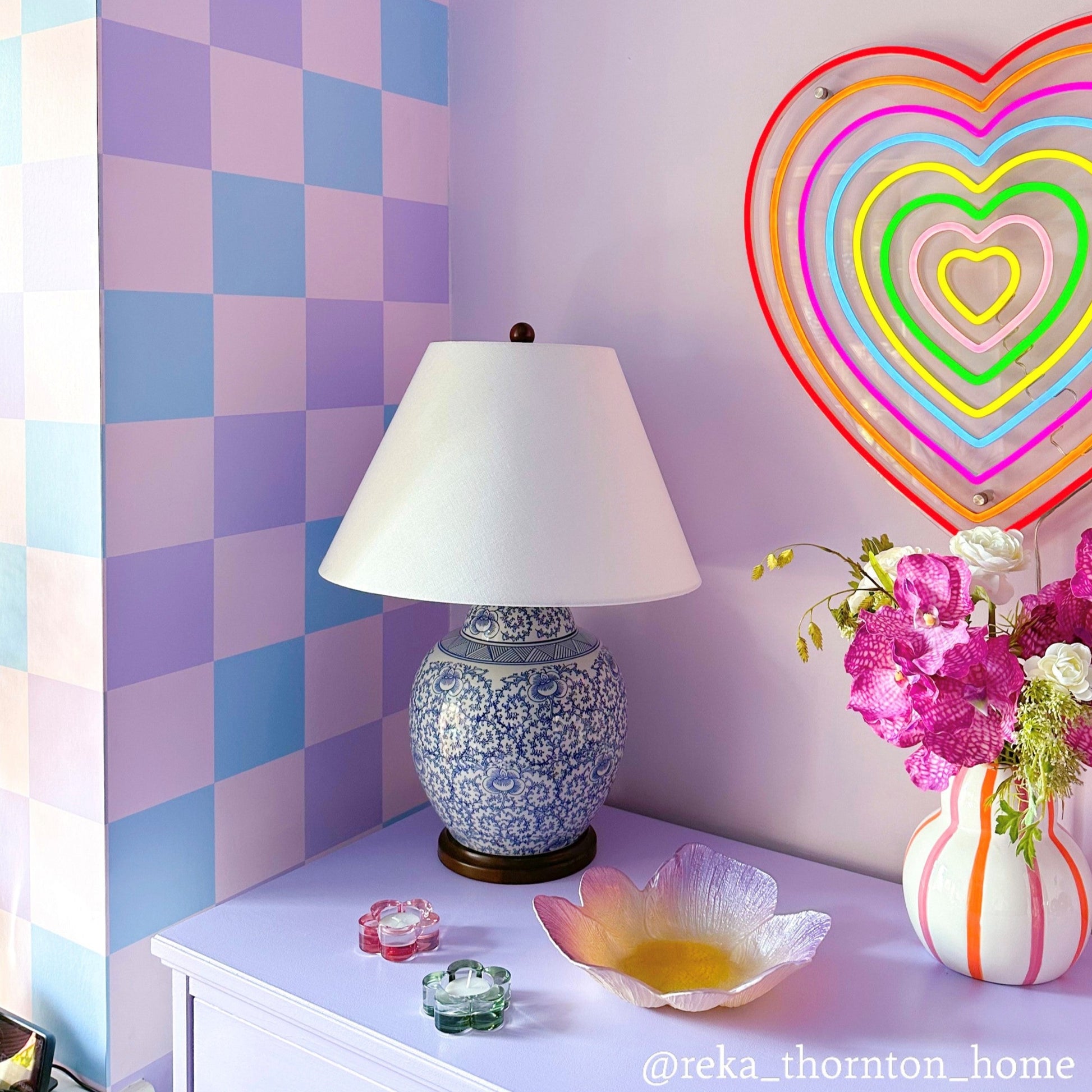 pastel wallpaper with checkerboard design in blue, pink and lavender